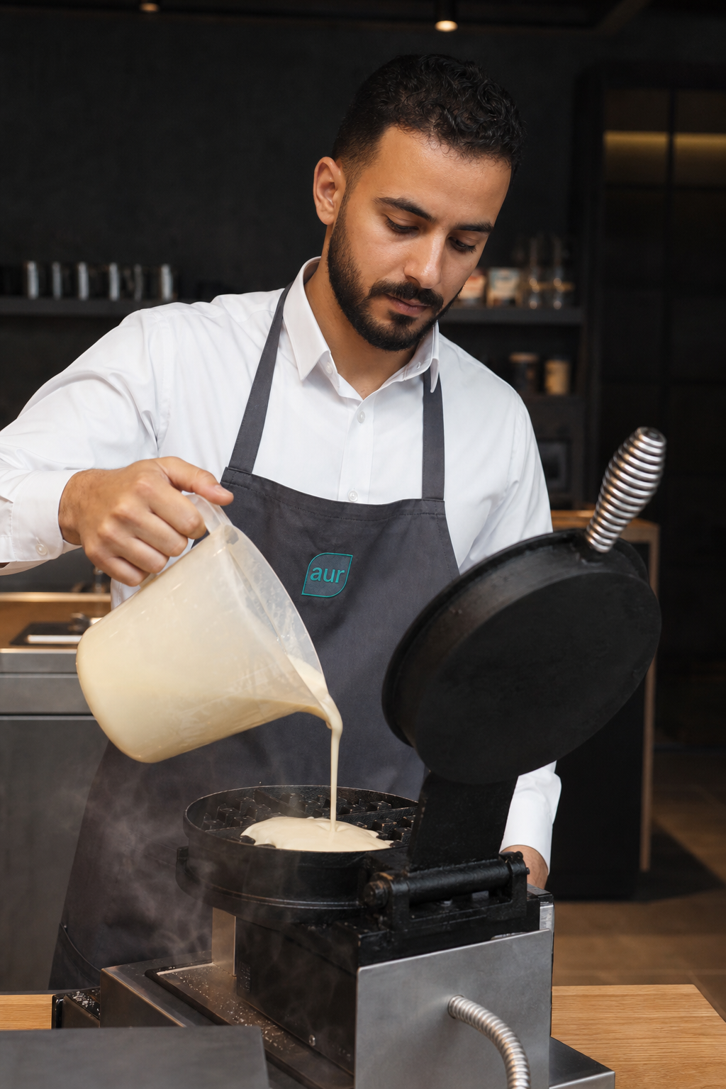 AUR Waffy expert pouring waffle batter